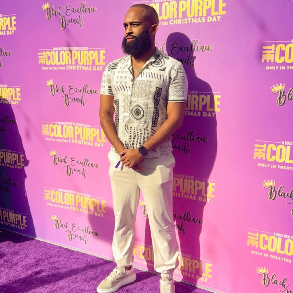Trevor Queen on the purple carpet at The Color Purple premiere